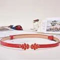 Women's skinny red patent leather belt with golden floral buckle and rhinestone detail - Enamel Petal Buckle / Red