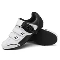 Zwart-witte fietsschoenen met ratelgesp en ademend bovenwerk van leer en mesh-stof - 36 / Rubber / Wit