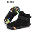 Detail view of black snow boots with plush lining and colorful anti-slip rubber outsole - 25 / Black