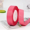 Roll of bright pink grosgrain ribbon with textured horizontal ridges for gift wrapping - Watermelon Red (65#)