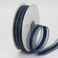 Navy blue sheer ribbon with gold metallic edges on white spool for DIY gift wrapping - Dark Blue