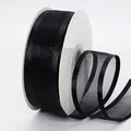 Black 4cm sheer organza ribbon with satin edges on a white spool for DIY gift wrapping - Black