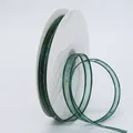 Deep green 1cm organza ribbon with gold metallic edge, presented on a spool roll - Dark Green