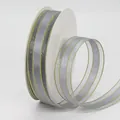 Grey sheer ribbon roll with golden trim edges for DIY hair accessories and bouquets - Gray