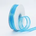 Light blue sheer chiffon ribbon with gold metallic edges on white spool for DIY crafts - Sky Blue With Gold Edge