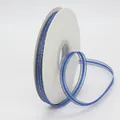 Blue decorative ribbon with double gold metallic edges on a roll for gift wrapping - Sapphire Blue