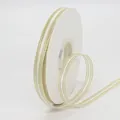 White ribbon with gold metallic parallel lines on a white spool for DIY gift wrapping - White