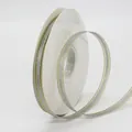Silver-grey satin ribbon with gold metallic edge on a spool for DIY gift wrapping - Gray
