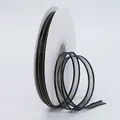 Black organza ribbon with gold trim on roll for DIY hair accessories and gift wrapping - Black