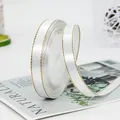 White satin ribbon with gold stitched edges for elegant gift packaging and DIY crafts - White