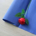 DIY bouquet wrapping with deep blue corrugated paper and a decorative red silk rose - Corrugated Paper / Sapphire Blue