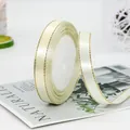 Cream satin ribbon with gold trim 1.2cm wide on white roll for luxury gift wrapping - Off White