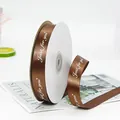 Dark brown satin ribbon with white Just for you print and heart motifs on a spool - Coffee