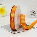 Roll of 2cm orange satin ribbon with white Just for you print for gift wrapping - Orange