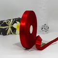 Vibrant red satin ribbon roll for gift wrapping with a premium glossy finish - Wide Double Sided Deep Red Style