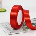 Roll of bright red polyester satin ribbon for festive wedding decor and gift wrapping - Wide Standard Bright Red Ribbon