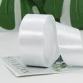 Single roll of elegant white satin ribbon with glossy polyester texture and smooth finish - Width 4cm / Length 22m / White