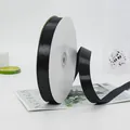 Roll of 2cm black satin ribbon for elegant gift wrapping and handcrafted floral bows - Standard Long Paper Core Roll (BH-44)