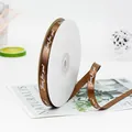 Bruin satijnen lint op rol met witte Just for you opdruk voor geschenken - Just For You Afdruk / koffiekleur