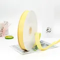 Roll of 2cm lemon yellow grosgrain ribbon for gift wrapping on a white spool - 2cm Wide 91m Long / Light gold