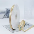 Rol van 1cm champagnekleurig satijnen lint voor cadeauverpakking en bloemdecoratie - Standaard Lange Spoel / Goud