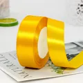 Heldergeel satijnen lint 2,5 cm breed voor cadeauverpakking en bruiloft decoratie - 21m Lengte / Goudgeel