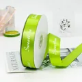 2.5cm green satin ribbon with white Sweetlove print for floral gift wrapping - Sweet Love / 2.5cmx45m/Roll / Grass Green