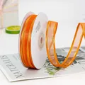 Orange chiffon ribbon with gold edges on white roll for gift and cake packaging - Double Gold Edge Orange