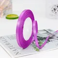 Glossy purple satin ribbon roll for gift wrapping and floral arrangements on a white core - Rose Red