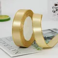Nastro di raso color oro champagne con bordi dorati per confezioni regalo su rotolo - Oro di Lusso