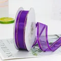 Sheer purple chiffon ribbon with gold metallic edges on a spool for gift wrapping - Purple with Gold Trim