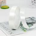 Detail of white satin ribbon roll for gift wrapping and wedding flower bouquets - Off White