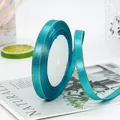 Roll of 1cm teal satin ribbon with gold metallic edge for gift wrapping and DIY crafts - Teal