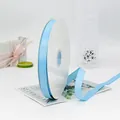 Nastro canneté celeste da 1,5 cm su rocchetto per confezioni regalo eleganti - Celeste