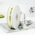 Cream 2.2cm organza ribbon with black Just For You text on a white cardboard spool - Just For You / Off White