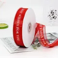 Red 2.2cm organza ribbon with white Best Wishes printing on a white plastic spool - BEST WISHES FOR YOU / Red