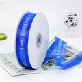 Navy blue snow yarn ribbon roll with white Forever Love text for gift wrapping - FOREVER LOVE / Sapphire Blue