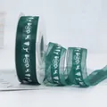 Dark green semi-transparent organza Christmas ribbon with white reindeer and tree patterns - Green Organza Ribbon