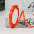 Vibrant bright orange 6mm satin ribbon roll for gift wrapping and DIY crafts decor - Orange Red