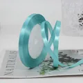 Light blue 6mm satin ribbon roll for gift wrapping on minimalist natural card - Light Blue