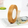 Golden yellow organza ribbon roll 2.5cm width with fine mesh texture and soft metallic sheen - Tan