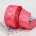 Coral pink grosgrain ribbon roll with ribbed texture for gift wrapping and DIY crafts - Watermelon red