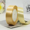 Roll of 38mm champagne gold satin ribbon with silky finish for elegant gift wrapping - Satin Style / Beige