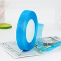 Sky blue 1.5cm sheer organza ribbon on white foam core for gift wrapping and DIY crafts - Teal