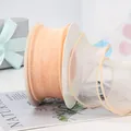 Ruban mousseline rose champagne sur bobine pour emballage de cadeaux et fleurs - En Rouleau / Champagne