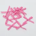 Set van mini roze satijnen strikjes voor DIY-knutselwerk en accessoireprojecten - Felroze