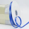 Roll of 1cm blue polyester satin ribbon on white spool for gift and floral packaging - Sapphire Blue