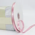 Polished pink polyester satin ribbon roll for elegant gift boxes and flower packaging - Pink