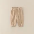 Pantaloni jogger in cotone beige per neonato con vita elastica e polsini a coste - Pantaloni e gonne / Kaki / 73cm