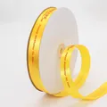 Roll of bright yellow satin ribbon with red Happy Birthday text for gift wrapping - 2cm / Yellow with Red Print